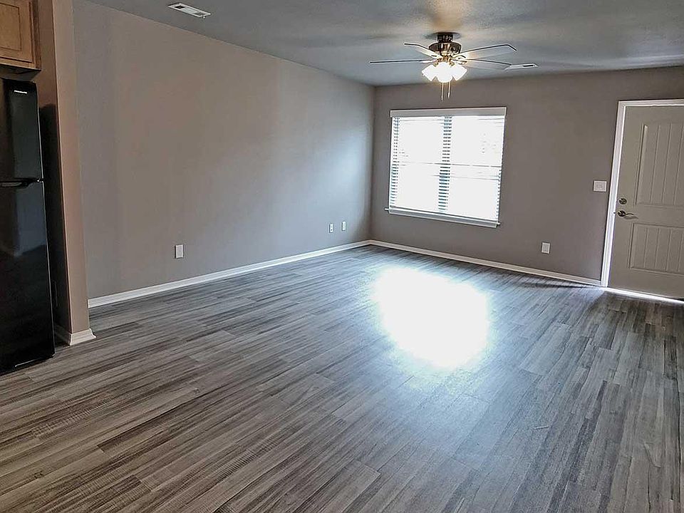 Well-lit living room with ceiling fan