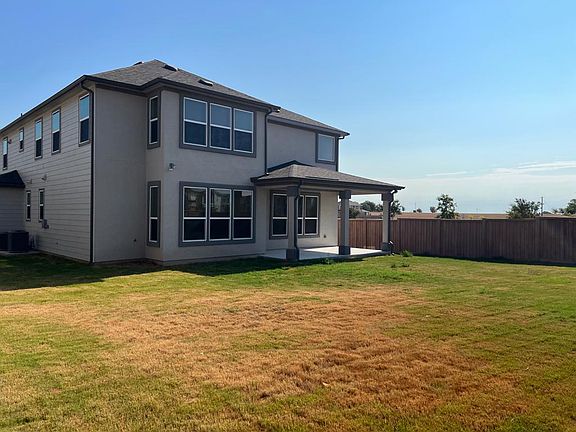 The backyard of the house with large space for play.