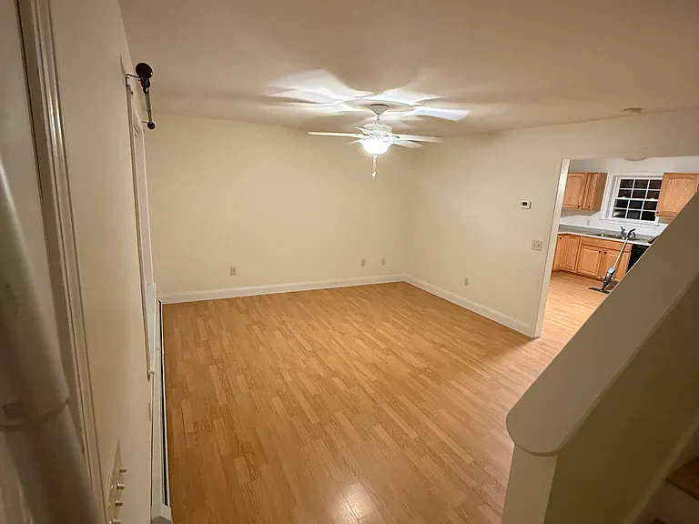 View from the bottom of the stairs into the livingroom