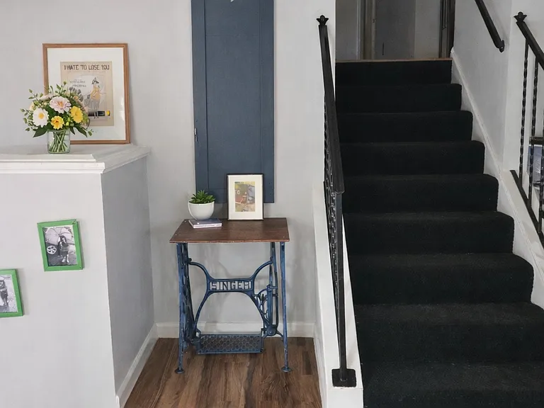 Split level hallways with new flooring and carpet.
