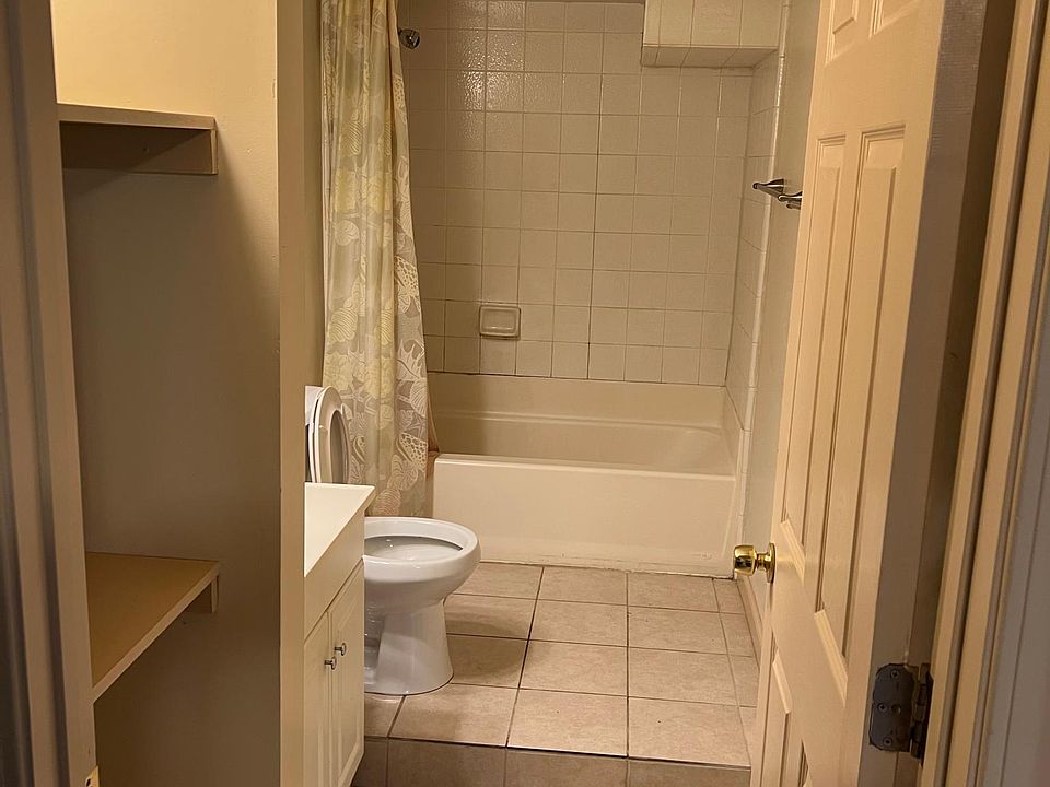 Recently updated large bath with linen shelves.