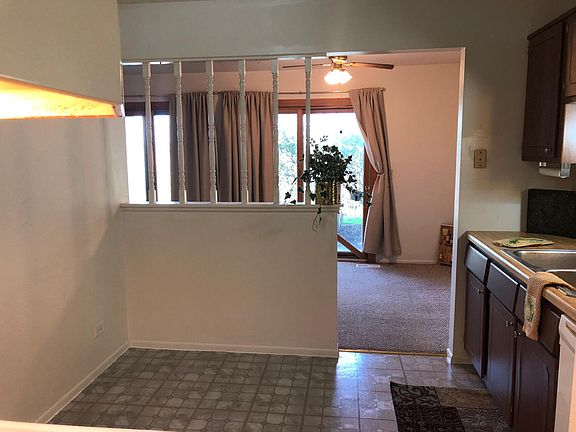 kitchen overlooking dining room & patio doors