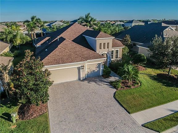 Oversized Garage with Refrigerator, and Utility Tub along with Gas Noritz Tankless Hot Water Heater.  Gas Heat, and Electric Air