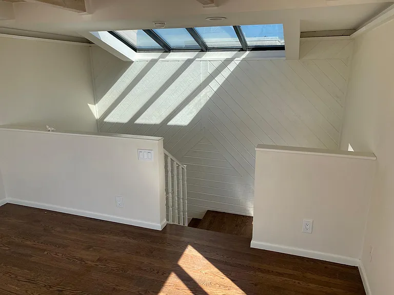Third floor landing facing away form the deck and ocean views.