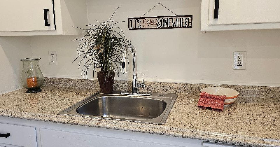 kitchen, new sink and faucet, new hardware to cabinets.