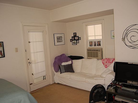 Master bedroom has a nook large enough for a couch, plus window a/c.