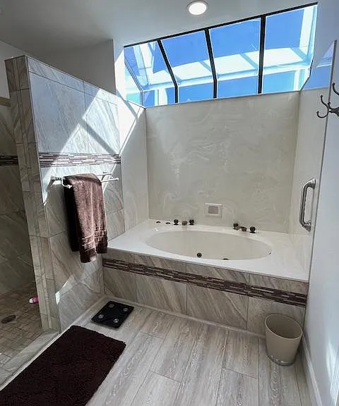 Sunny garden soaking tub with jets