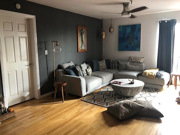 Living Area has floor-to-ceiling corner window with views.