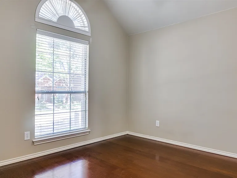 Front guest bedroom is adjacent to bath.