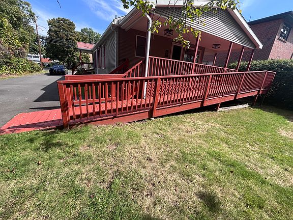 Covered back porch with ramp for wheelchair/walker entrance