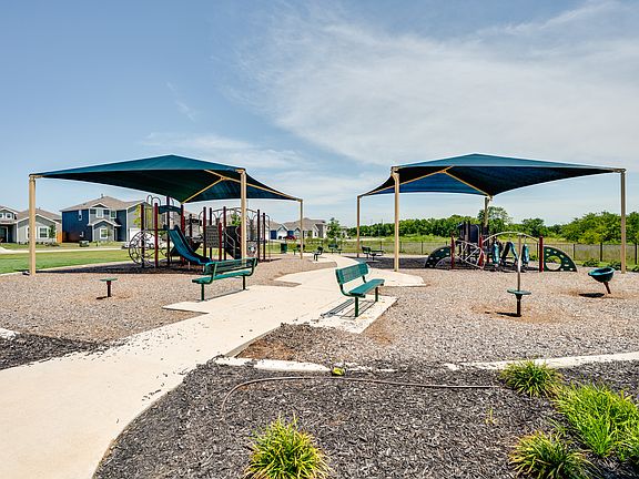 The community park has covered playgrounds and a walking path.