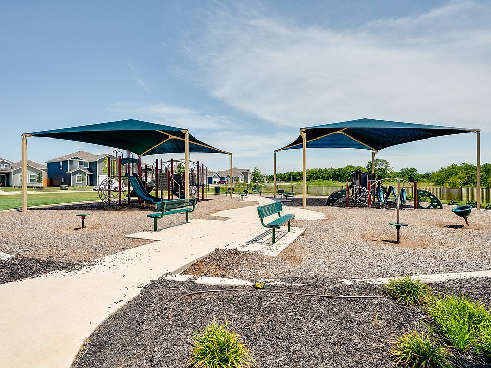 The community park has covered playgrounds and a walking path.