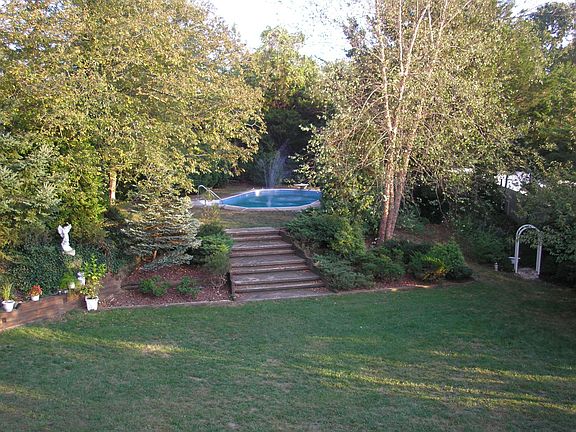 View from Bedroom to pool side & back yard