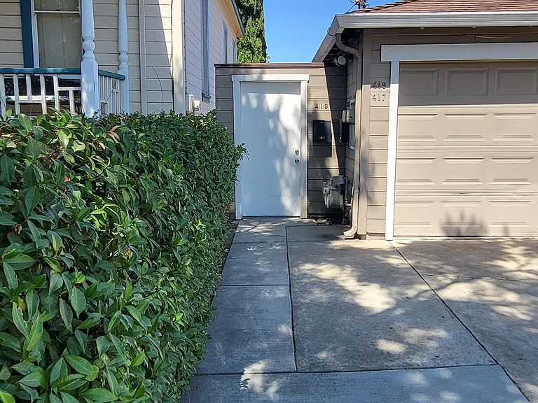 Side Entrance, garage, and off street parking