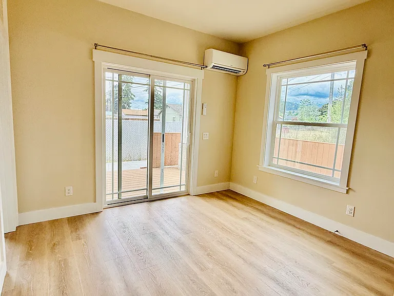 Living area leads to sliding glass door to outside deck