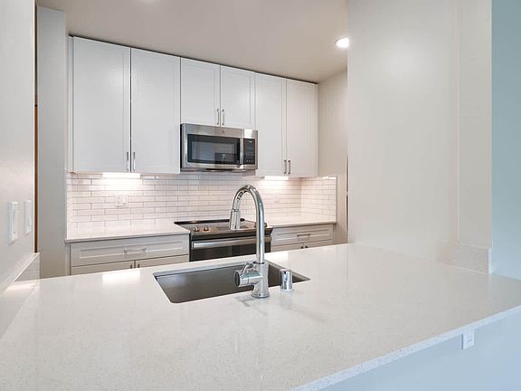 Kitchen with Breakfast Bar and Stainless Steel Appliances