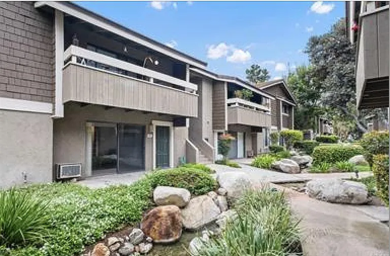 Bottom floor unit. Patio door opens to cement patio.