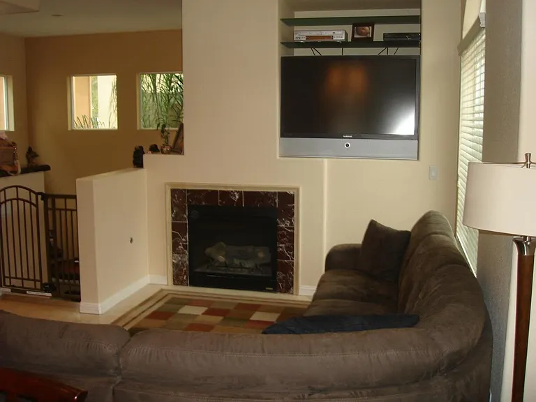 Living room next to kitchen and dining
