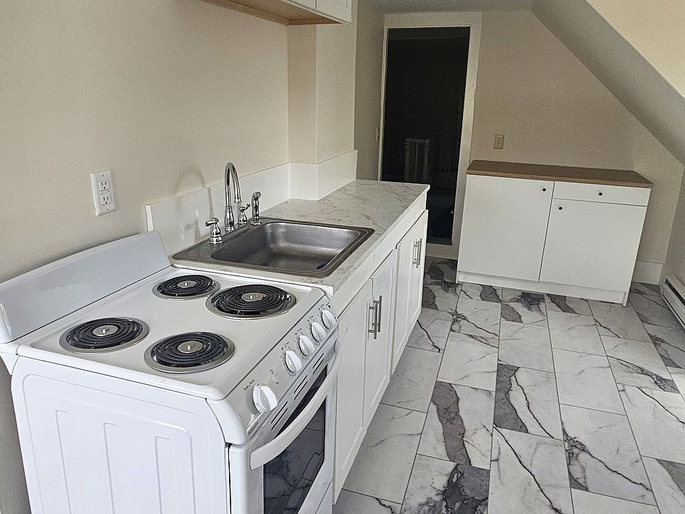 Additional counter and cupboard space.
Door at rear leads to the center hall way