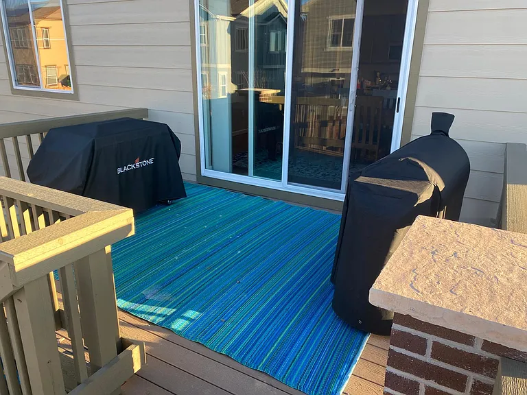 Deck with sliding glass door to kitchen area