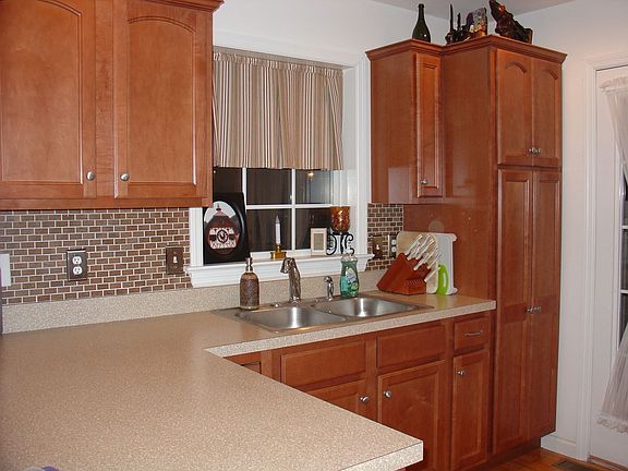tile backsplash and hardwood floors