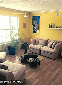 BRIGHT LIVING ROOM WITH PERGO WOOD FLOORING