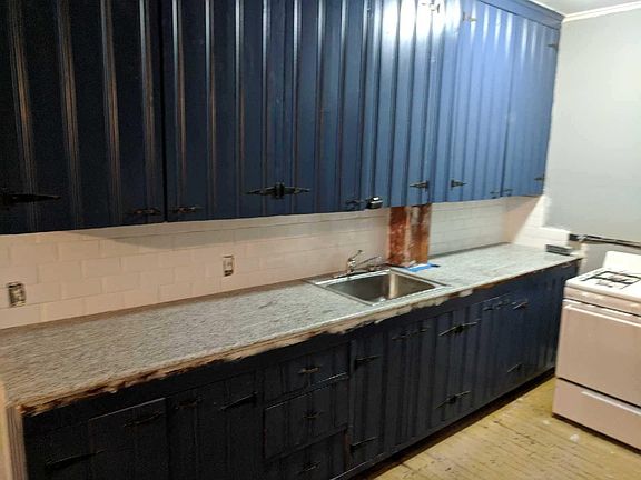 Freshly painted kitchen with original cabinets with granite 