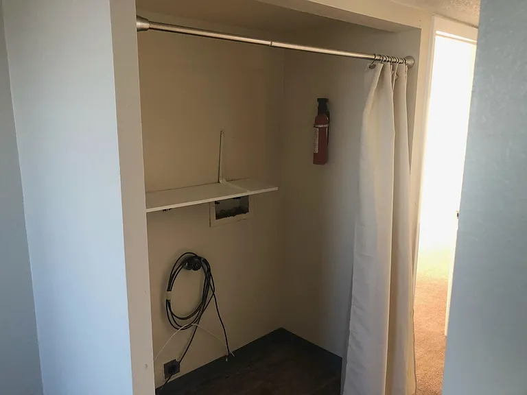 laundry area for full sized washer and dryer