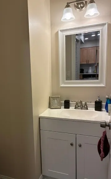 First-floor half-bath. New vanity and fixtures.