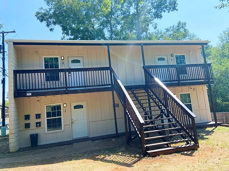 Enjoy spending time outdoors on the spacious, covered front porch, perfect for relaxing or socializing with friends.
