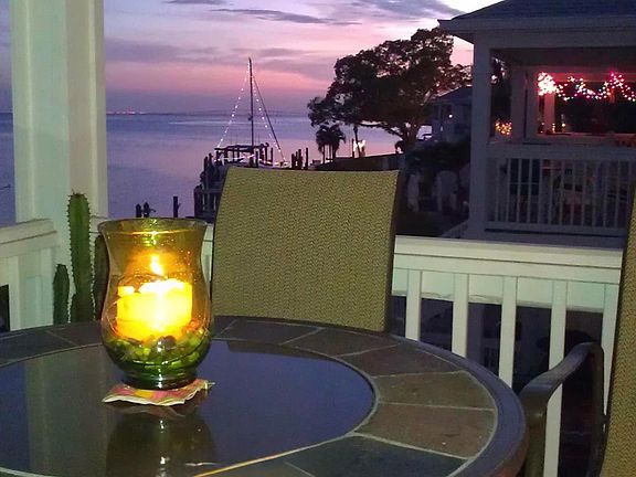 Enjoy breathtaking sunsets from the covered patio - perfect for an evening cocktail.
