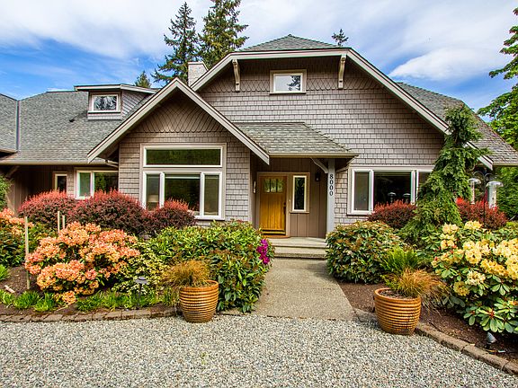 Professionally landscaped with color throughout every season, the entry way draws you in with rich vibrant plantings.