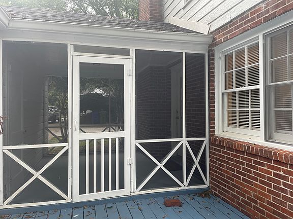 Screened-in porch leading to deck