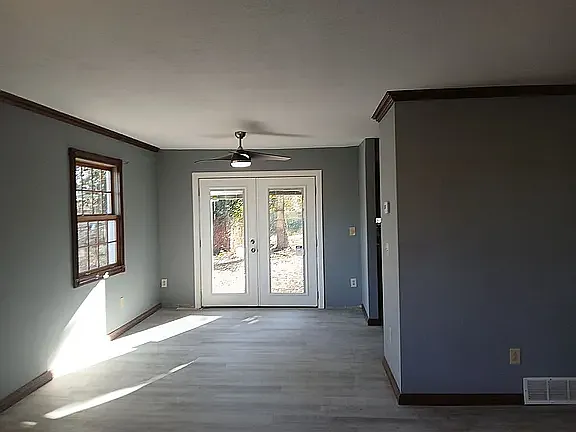 Doors going to backyard off of living room