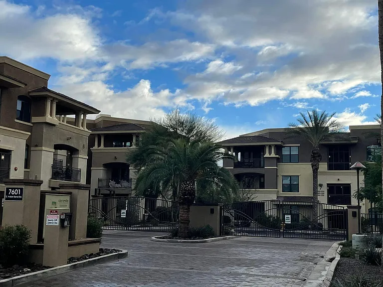 Secure entrance view with top floor unit middle left
