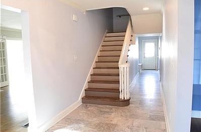 Grand entry with gorgeous tile flooring.  Formal dining room to the right, lovely living room to the left with fireplace and two sets of French doors leading to sunroom