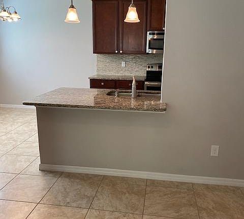 looking at snack bar and kitchen from living room