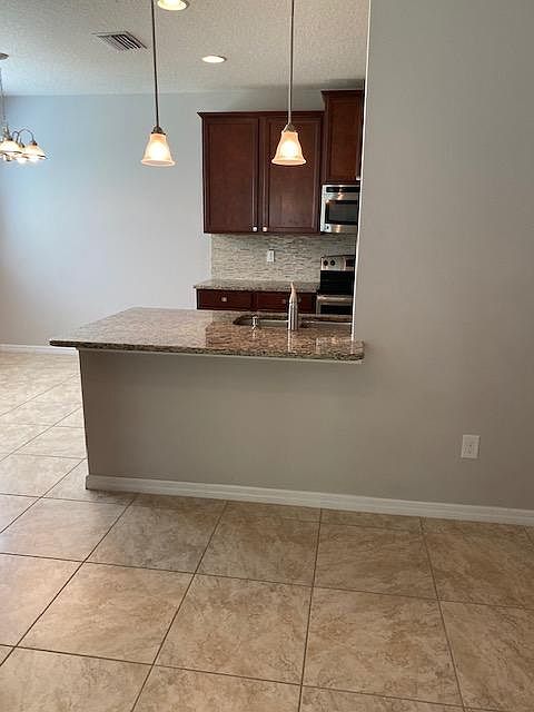 looking at snack bar and kitchen from living room
