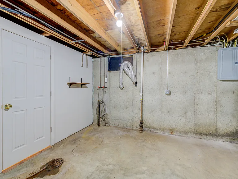 Basement laundry area - new electric box and that is the door to the 2nd full bathroom to the left.