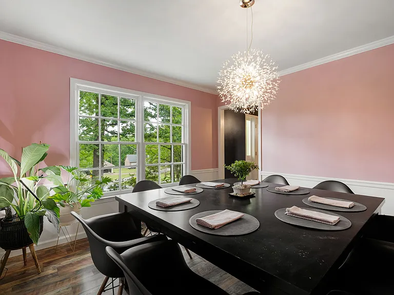 Second perspective of dining room, with windows facing the front lawn