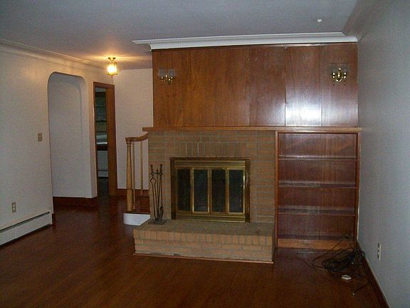 Offers wood burning FP, picture window & HW floors