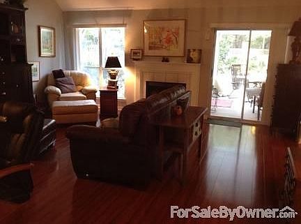 Wood fireplace, high ceilings, pool view
						:
						Shiny hard wood floors catch the eye when you walk in the front door.