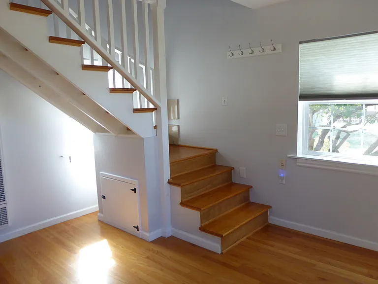 stairs leading up to open bedroom