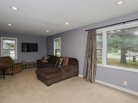 Large picture window and beautiful tees to view outside!