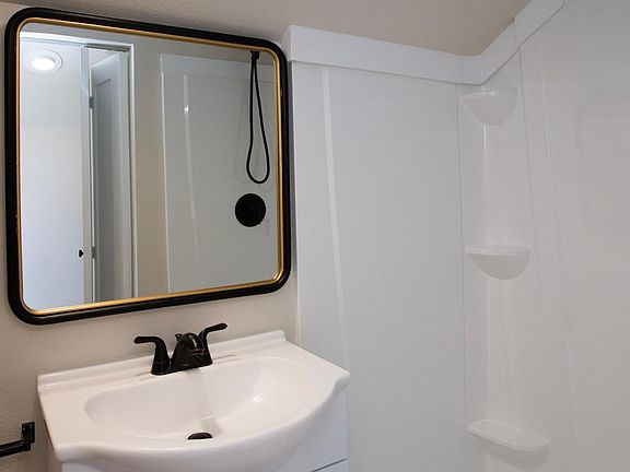 Three piece bathroom with generous shower.