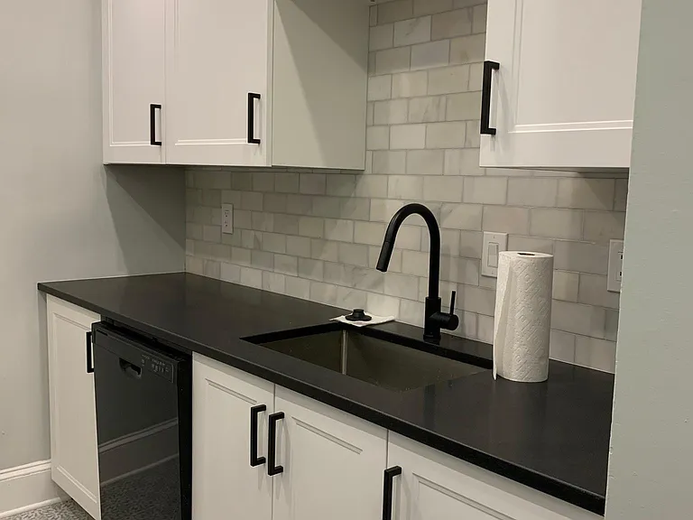 New cabinets, tile, backsplash, microwave - paper towels not included