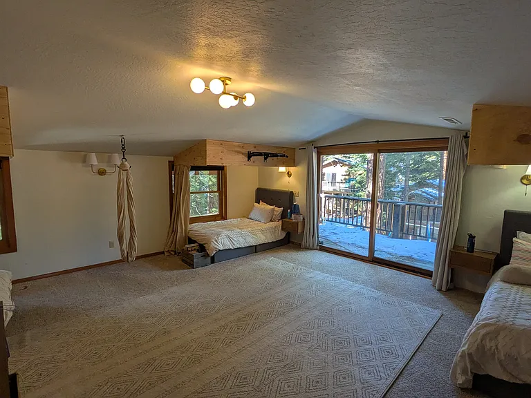 Second large upstairs suite includes full bath and private deck overlooking the backyard