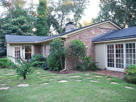 Back Entry (Grass/Stone Patio)