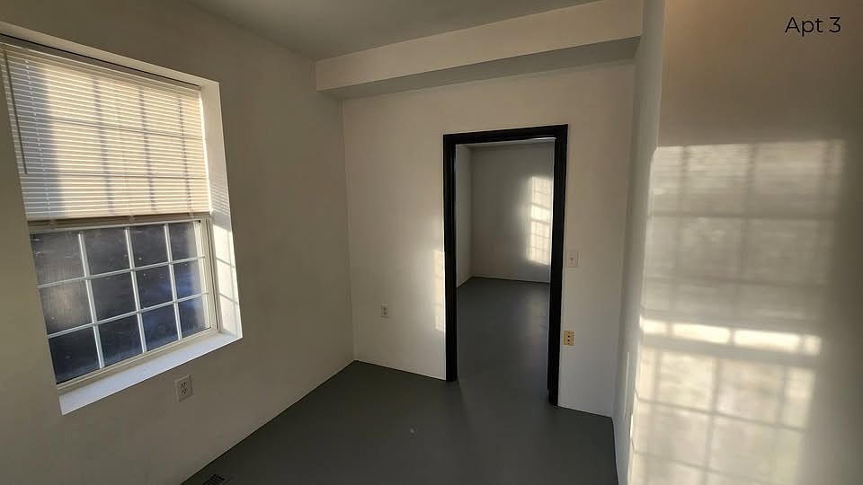 Living room with view into the bedroom