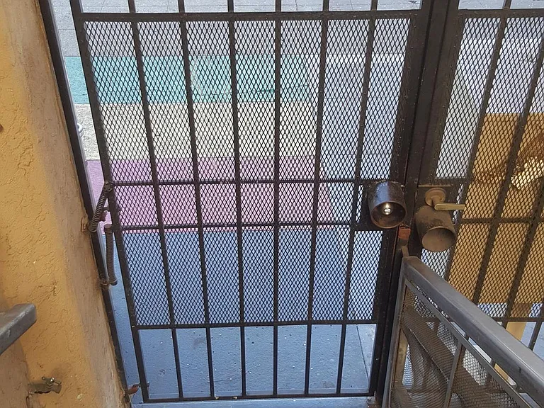 downstairs to gate - front. Back is also gated.